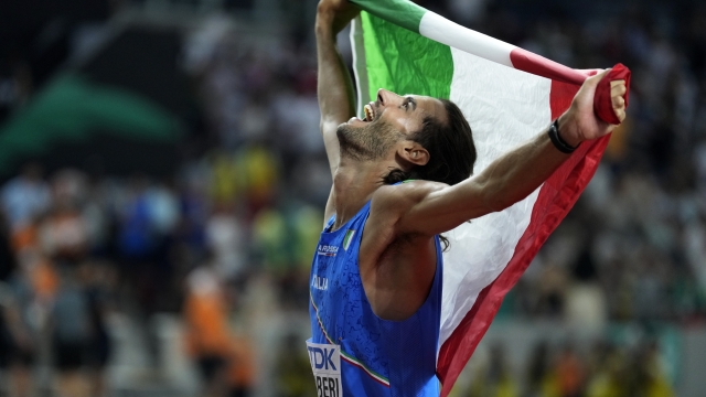 FILE - Gianmarco Tamberi, of Italy, celebrates after winning the gold medal in the Men's high jump final during the World Athletics Championships in Budapest, Hungary, on Aug. 22, 2023. Fencer Arianna Errigo and high jumper Gianmarco Tamberi were named as Italy’s flagbearers Monday, April 29, 2024 for the Paris Olympics opening ceremony. (AP Photo/Ashley Landis)