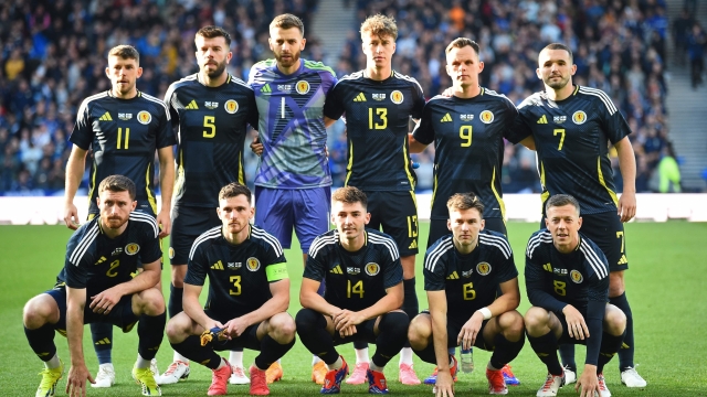 (L-R back row) Scotland's striker #11 Ryan Christie, Scotland's defender #05 Grant Hanley, Scotland's goalkeeper #01 Angus Gunn, Scotland's defender #13 Jack Hendry, Scotland's striker #09 Lawrence Shankland and Scotland's midfielder #07 John McGinn, (L-R front row) Scotland's defender #02 Anthony Ralston, Scotland's defender #03 Andrew Robertson, Scotland's midfielder #14 Billy Gilmour, Scotland's defender #06 Kieran Tierney and Scotland's midfielder #08 Callum McGregor pose for a team photo ahead of kick-off in the international friendly football match between Scotland and Finland, at Hampden Park in Glasgow, on June 7, 2027. (Photo by ANDY BUCHANAN / AFP)