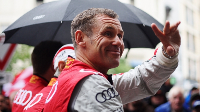 LE MANS, FRANCE - JUNE 15:  Tom Kristensen of Denmark and Audi Sport E-Tron Quattro attends the drivers parade during previews for the Le Mans 24 Hour race on June 15, 2012 in Le Mans, France.  (Photo by Ker Robertson/Getty Images)