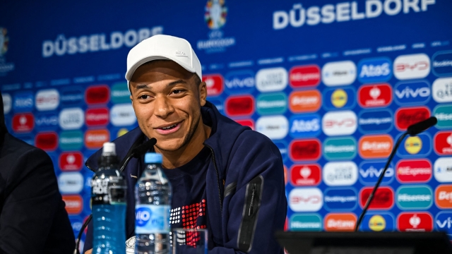 This handout photo taken and released by UEFA on June 16, 2024, shows France's forward #10 Kylian Mbappe giving an MD-1 perss conference Duesseldorf Arena in Duesseldorf, on the eve of their UEFA Euro 2024 Group D football match against Austria. (Photo by Frederic SCHEIDEMANN / UEFA / AFP) / RESTRICTED TO EDITORIAL USE - MANDATORY CREDIT "AFP PHOTO / UEFA" - NO MARKETING NO ADVERTISING CAMPAIGNS - DISTRIBUTED AS A SERVICE TO CLIENTS