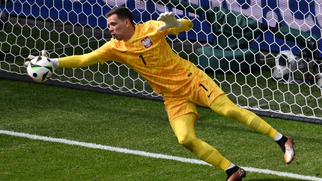 Poland's goalkeeper #01 Wojciech Szczesny blocks a shot during the UEFA Euro 2024 Group D football match between Poland and the Netherlands at the Volksparkstadion in Hamburg on June 16, 2024. (Photo by Christophe SIMON / AFP)