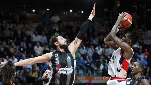 Marco Belinelli of Virtus Segafredo Bologna and Brianté Weber of Unahotels Reggio Emilia in action during the Italian Final Eight basketball match Virtus Segafredo Bologna vs Unahotels Reggio Emilia at the Inalpi Arena indoor stadium in Turin, Italy, 15 February 2024. ANSA/ALESSANDRO DI MARCO