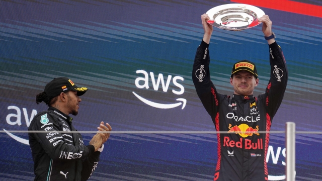 epa10672645 Winner Dutch Formula One driver Max Verstappen (R) of Red Bull Racing celebrates with second-placed British driver Lewis Hamilton of Mercedes on the podium after the Formula 1 Grand Prix of Spain 2023 at the Circuit de Barcelona-Catalunya, in Barcelona, Spain, 04  June 2023.  EPA/Siu Wu