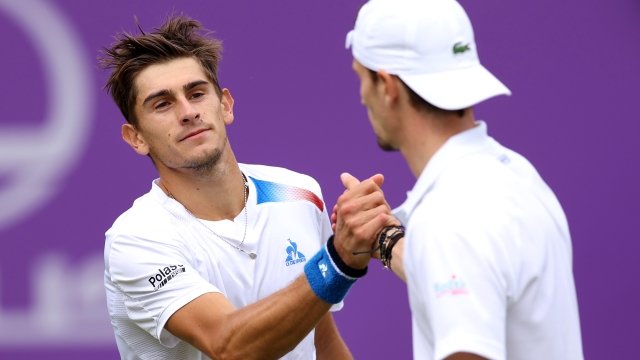LONDON, ENGLAND - JUNE 18: Matteo Arnaldi of Italy shakes hands with Ugo Humbert of France following the Men's Singles Round of 32 match on Day Two of the cinch Championships at The Queen's Club on June 18, 2024 in London, England. (Photo by Clive Brunskill/Getty Images)
