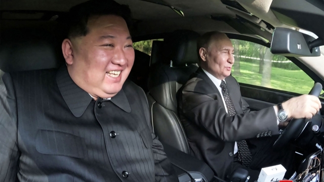 This picture taken on June 19, 2024 and released on June 20, 2024 from North Korea's official Korean Central News Agency (KCNA) via KNS shows North Korea's leader Kim Jong Un (L) sitting in the passenger seat of a car driven by Russia's President Vladimir Putin (R) in the garden of the Kumsusan State Guesthouse in Pyongyang. (Photo by KCNA VIA KNS / AFP) / South Korea OUT / ---EDITORS NOTE--- RESTRICTED TO EDITORIAL USE - MANDATORY CREDIT "AFP PHOTO/KCNA VIA KNS" - NO MARKETING NO ADVERTISING CAMPAIGNS - DISTRIBUTED AS A SERVICE TO CLIENTS THIS PICTURE WAS MADE AVAILABLE BY A THIRD PARTY. AFP CAN NOT INDEPENDENTLY VERIFY THE AUTHENTICITY, LOCATION, DATE AND CONTENT OF THIS IMAGE. /