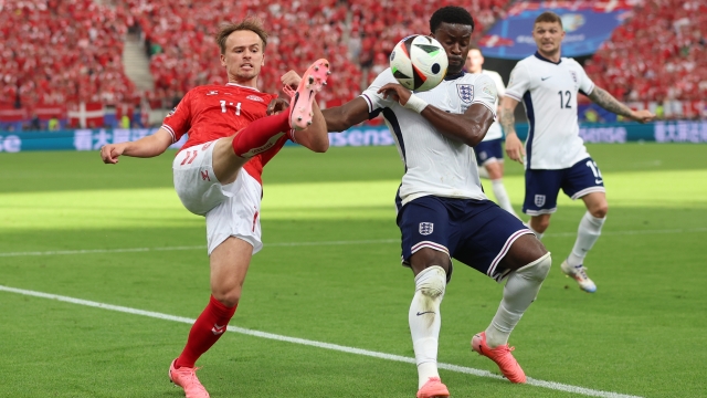 FRANKFURT AM MAIN, GERMANY - JUNE 20: Mikkel Damsgaard of Denmark attempts to control the ball whilst under pressure from Marc Guehi of England  during the UEFA EURO 2024 group stage match between Denmark and England at Frankfurt Arena on June 20, 2024 in Frankfurt am Main, Germany. (Photo by Richard Pelham/Getty Images)