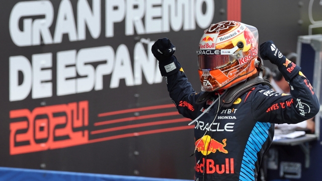 TOPSHOT - Red Bull's Dutch driver Max Verstappen celebrates winning the Spanish Formula One Grand Prix at the Circuit de Catalunya on June 23, 2024 in Montmelo, on the outskirts of Barcelona. (Photo by Thomas COEX / AFP)