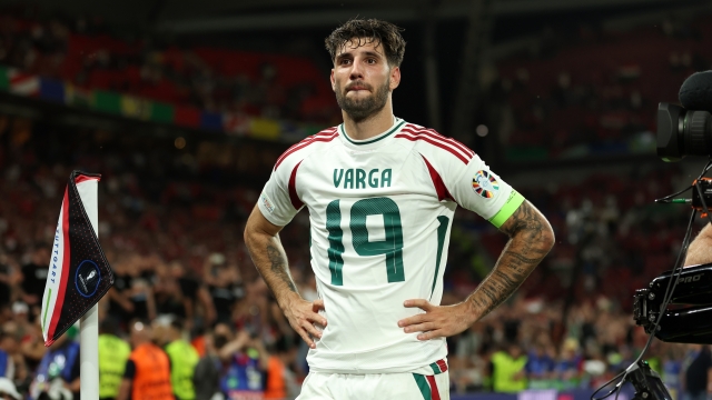 STUTTGART, GERMANY - JUNE 23: Barnabas Varga of Hungary looks on after the team's victory whilst wearing the shirt of teammate Barnabas Varga (not pictured), who left the field following an injury, during the UEFA EURO 2024 group stage match between Scotland and Hungary at Stuttgart Arena on June 23, 2024 in Stuttgart, Germany. (Photo by Carl Recine/Getty Images)