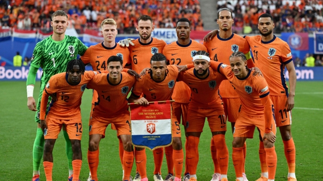(From L) Netherlands' goalkeeper #01 Bart Verbruggen, Netherlands' forward #12 Jeremie Frimpong, Netherlands' midfielder #24 Jerdy Schouten, Netherlands' midfielder #14 Tijani Reijnders, Netherlands' defender #06 Stefan de Vrij, Netherlands' defender #05 Nathan Ake, Netherlands' defender #22 Denzel Dumfries, Netherlands' forward #10 Memphis Depay, Netherlands' defender #04 Virgil Van Dijk, Netherlands' forward #07 Xavi Simons and Netherlands' forward #11 Cody Gakpo pose prior to the UEFA Euro 2024 Group D football match between the Netherlands and France at the Leipzig Stadium in Leipzig on June 21, 2024. (Photo by Christophe SIMON / AFP)