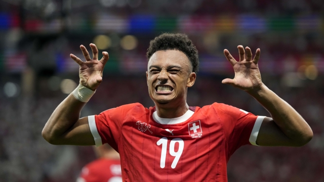 Switzerland's Dan Ndoye celebrates after scoring his sides first goal during a Group A match between Switzerland and Germany at the Euro 2024 soccer tournament in Frankfurt, Germany, Sunday, June 23, 2024. (AP Photo/Themba Hadebe)