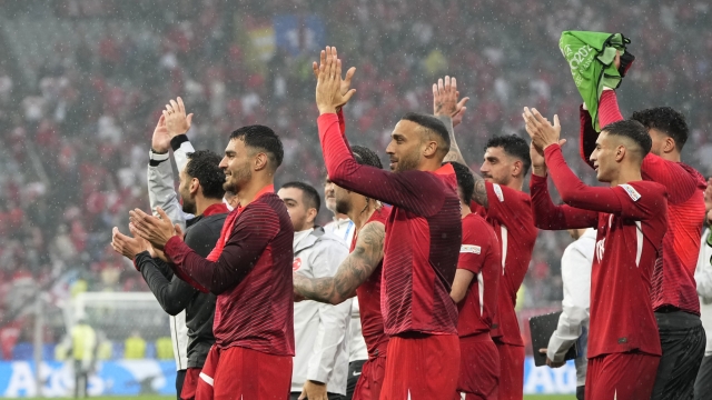 Turkey's players celebrate after winning a Group F match between Turkey and Georgia at the Euro 2024 soccer tournament in Dortmund, Germany, Tuesday, June 18, 2024. Turkey won 3-1. (AP Photo/Alessandra Tarantino)