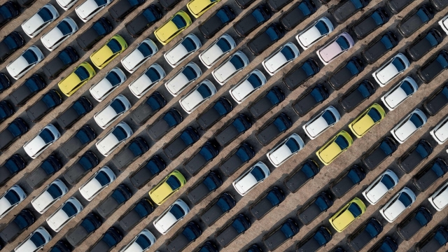 TOPSHOT - This photo taken on April 18, 2024 shows BYD electric cars for export waiting to be loaded onto a ship at a port in Yantai, in eastern China's Shandong province. (Photo by AFP) / China OUT