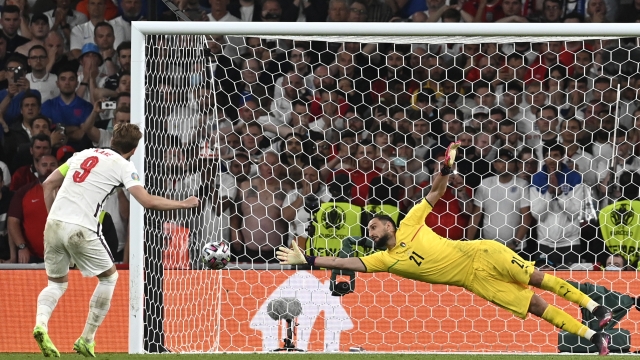 FILE - England's Harry Kanem left, shoots to score past Italy's goalkeeper Gianluigi Donnarumma during penalty shootout of the Euro 2020 soccer championship final match between England and Italy at Wembley Stadium in London, Sunday, July 11, 2021. The penalty shootout is a tense battle of wills over 12 yards (11 meters) that has increasingly become a huge part of soccer and an unavoidable feature of the knockout stage in the biggest competitions. (Paul Ellis/Pool via AP, File)