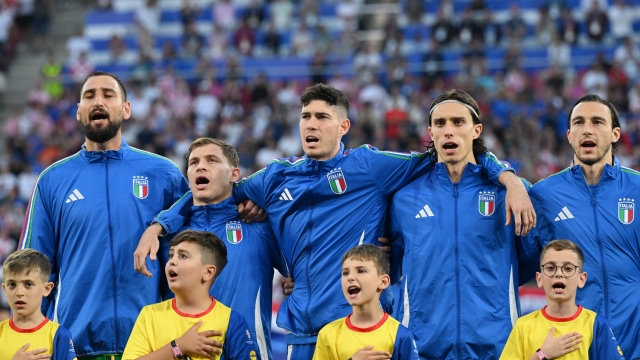 LEIPZIG, GERMANY - JUNE 24: (L-R) Gianluigi Donnarumma, Nicolo Barella, Alessandro Bastoni, Riccardo Calafiori and Matteo Darmian sing their national anthem with mascots prior to kick-off ahead of the UEFA EURO 2024 group stage match between Croatia and Italy at Football Stadium Leipzig on June 24, 2024 in Leipzig, Germany. (Photo by Claudio Villa/Getty Images for FIGC)