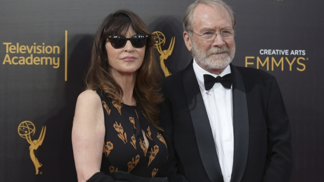 FILE -Wendy Haas, left, and Martin Mull arrive at night one of the Creative Arts Emmy Awards at the Microsoft Theater on Saturday, Sept. 10, 2016, in Los Angeles. Martin Mull, whose droll, esoteric comedy and acting made him a hip sensation in the 1970s and later a beloved guest star on sitcoms including ?Roseanne? and ?Arrested Development,? has died, his daughter said Friday, June 28, 2024. (Photo by Richard Shotwell/Invision/AP, File)