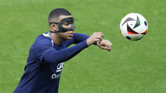 France's Kylian Mbappe eyes the ball during a training session in Paderborn, Germany, Thursday, June 27, 2024, ahead of their round of 16 soccer match against Belgium at the Euro 2024 soccer tournament. (AP Photo/Hassan Ammar)