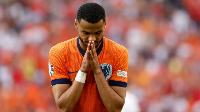 Netherlands' forward #11 Cody Gakpo reacts to a missed chance during the UEFA Euro 2024 Group D football match between the Netherlands and Austria at the Olympiastadion in Berlin on June 25, 2024. (Photo by Odd ANDERSEN / AFP)