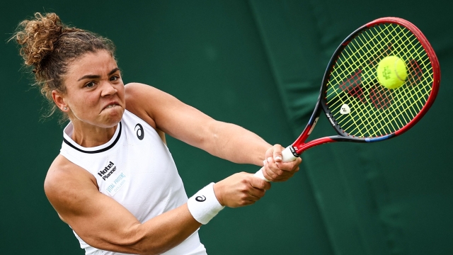 Italy's Jasmine Paolini returns the ball to Spain's Sara Sorribes Tormo during their Women's singles tennis match on the first day of the 2024 Wimbledon Championships at The All England Lawn Tennis and Croquet Club in Wimbledon, southwest London, on July 1, 2024. (Photo by HENRY NICHOLLS / AFP) / RESTRICTED TO EDITORIAL USE