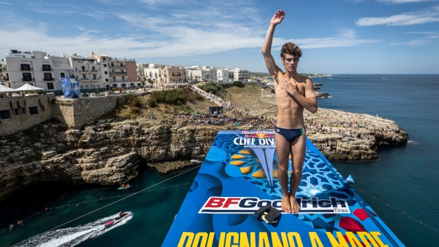 Andrea Barnaba of Italy prepares to dive from the 28 metre platform during the second competition day of the seventh stop of the Red Bull Cliff Diving World Series at Polignano a Mare, Italy on September 17, 2022. // Romina Amato / Red Bull Content Pool // SI202209170265 // Usage for editorial use only //