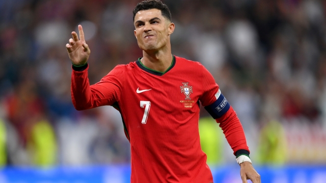 FRANKFURT AM MAIN, GERMANY - JULY 01: Cristiano Ronaldo of Portugal celebrates scoring the team's first penalty in the penalty shoot out during the UEFA EURO 2024 round of 16 match between Portugal and Slovenia at Frankfurt Arena on July 01, 2024 in Frankfurt am Main, Germany. (Photo by Justin Setterfield/Getty Images)