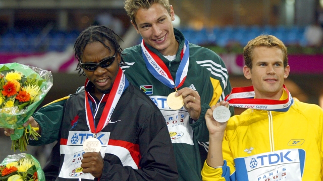 From left: Canada's Mark Boswell, bronze, South Africa's Jacques Freitag, gold, and Sweden's Stefan Holm, silver,  during the presentation ceremony for the Men's high jump at the World Athletics Championships at the Stade de France in Saint Denis, north of Paris Tuesday Aug. 26, 2003.