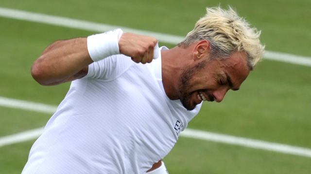 LONDON, ENGLAND - JULY 03: Fabio Fognini of Italy celebrates winning match point against Casper Ruud of Norway in his Men's Singles second round match during day three of The Championships Wimbledon 2024 at All England Lawn Tennis and Croquet Club on July 03, 2024 in London, England. (Photo by Clive Brunskill/Getty Images)