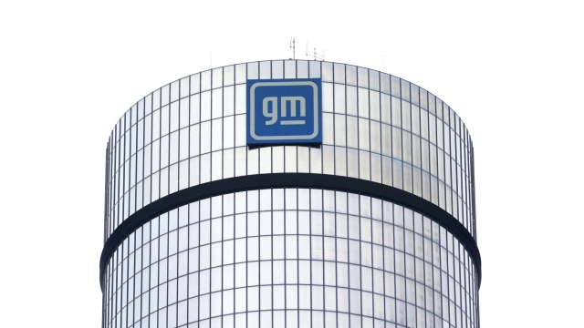 FILE - A General Motors logo is seen on a building, April 24, 2024, in Detroit. GM will pay nearly $146 million in penalties to the federal government because 5.9 million of its older vehicles don?t comply with emissions and fuel economy standards.  (AP Photo/Paul Sancya, File)