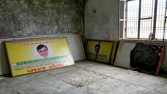 Hoardings with portraits of former police constable-turned-Hindu preacher Bhole Baba are kept at a workshop near his ashram in Bichhawan village of Mainpuri district, in Indias Uttar Pradesh state on July 4, 2024. Former police constable-turned-preacher Bhole Baba built an immense following among poor and marginalised Indians before his latest sermon ended in a stampede that killed 121 of his followers. (Photo by Arun SANKAR / AFP)