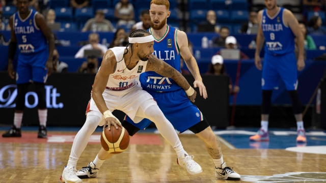 Puerto Rico's Jose Alvarado (L) dribbles the ball against Italy's Nico Mannion during the 2024 FIBA Men's Olympic Qualifying Tournament basketball match between Puerto Rico and Italy in San Juan, Puerto Rico, on July 4, 2024. (Photo by Ricardo ARDUENGO / AFP)