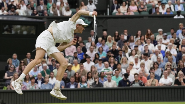 Jannik Sinner of Italy serves to Daniil Medvedev of Russia during their quarterfinal match at the Wimbledon tennis championships in London, Tuesday, July 9, 2024. (AP Photo/Alberto Pezzali)