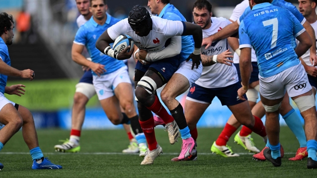 France's flanker Ibrahim Diallo (C-left) and Uruguay's wing Mateo Vinals fight for the ball during the Rugby Union test match between Uruguay and France at the Charrua Stadium in Montevideo on July 10, 2024. (Photo by Eitan ABRAMOVICH / AFP)
