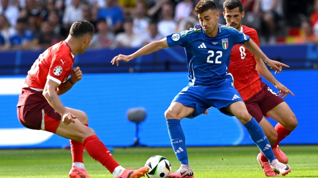 BERLIN, GERMANY - JUNE 29: Stephan El Shaarawy of Italy is challenged by Granit Xhaka and Remo Freuler of Switzerland during the UEFA EURO 2024 round of 16 match between Switzerland and Italy at Olympiastadion on June 29, 2024 in Berlin, Germany. (Photo by Claudio Villa/Getty Images for FIGC)