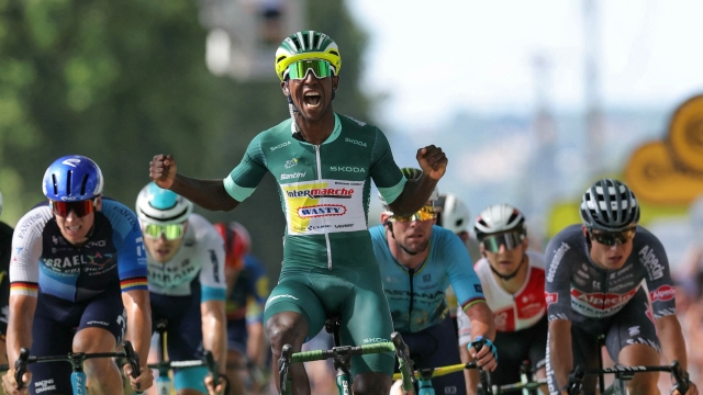 Intermarche - Wanty team's Eritrean rider Biniam Girmay wearing the sprinter's green jersey sprints past the finish line to win the 12th stage of the 111th edition of the Tour de France cycling race, 203,6 km between Aurillac and Villeneuve-sur-Lot, southwestern France, on July 11, 2024. (Photo by Thomas SAMSON / AFP)