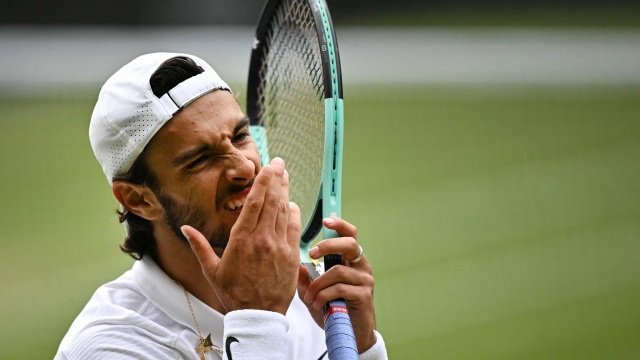 Italy's Lorenzo Musetti reacts after losing a point in the third set against Serbia's Novak Djokovic during their men's singles semi-final tennis match on the twelfth day of the 2024 Wimbledon Championships at The All England Lawn Tennis and Croquet Club in Wimbledon, southwest London, on July 12, 2024. Djokovic won the match 6-4, 7-6, 6-4. (Photo by Ben Stansall / AFP) / RESTRICTED TO EDITORIAL USE