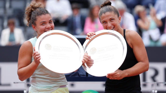 ROME, ITALY - MAY 19:  Sara Errani of Italy and Jasmine Paolini of Italy pose with their trophies after defeating Coco Gauff of the United States and Erin Routliffe of New Zealand in their Women's Doubles Final match on Day 14 of the Internazionali BNL D'Italia 2024 at Foro Italico on May 19, 2024 in Rome, Italy. (Photo by Dan Istitene/Getty Images) *** BESTPIX ***
