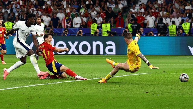epa11478693 Mikel Oyarzabal of Spain (2L) scores the 2-1 during the UEFA EURO 2024 final soccer match between Spain and England, in Berlin, Germany, 14 July 2024.  EPA/FILIP SINGER