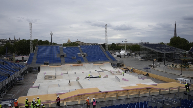 Workers operate on La Concorde olympic venue Wednesday, July 3, 2024 in Paris. The Concorde venue will host 3X3 basketball and BMX freestyle, Breaking and Skateboarding during the Paris Olympic Games. (AP Photo/Thibault Camus)