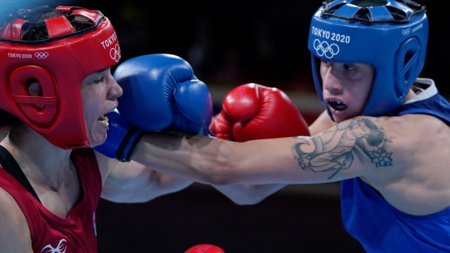 TOKYO, JAPAN - JULY 28: Caroline Veyre (red) of Canada exchanges punches with Irma Testa of Italy during the Women's Feather (54-57kg) quarter final on day five of the Tokyo 2020 Olympic Games at Kokugikan Arena on July 28, 2021 in Tokyo, Japan. (Photo by Frank Franklin - Pool/Getty Images)