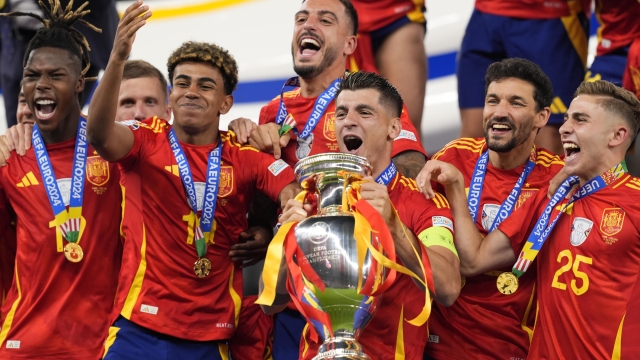 Spain's Alvaro Morata vith the trophy for the celebration after the final match between Spain and England at the Euro 2024 soccer tournament in Berlin at Olympiastadium, Germany, Sunday, July 14, 2024.Sport - Soccer . (Photo by Fabio Ferrari/LaPresse)