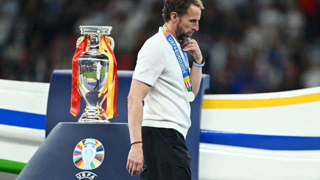 BERLIN, GERMANY - JULY 14: Gareth Southgate, Head Coach of England, walks past the UEFA Euro 2024 Henri Delaunay Trophy after defeat in the UEFA EURO 2024 final match between Spain and England at Olympiastadion on July 14, 2024 in Berlin, Germany. (Photo by Dan Mullan/Getty Images)