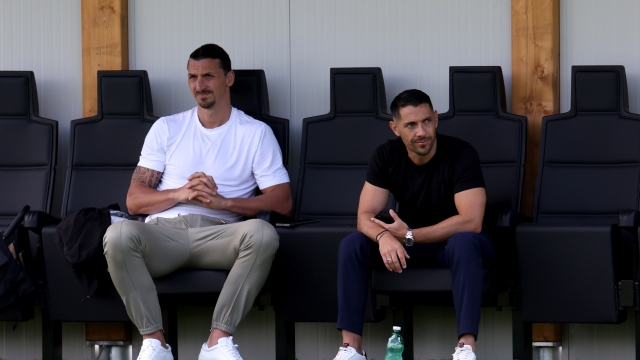 CAIRATE, ITALY - JULY 12: AC Milan Senior Advisor to Ownership Zlatan Ibrahimovic and AC Milan chief scout Geoffrey Moncada look on during the AC Milan training session at Milanello on July 12, 2024 in Cairate, Italy. (Photo by Claudio Villa/AC Milan via Getty Images)