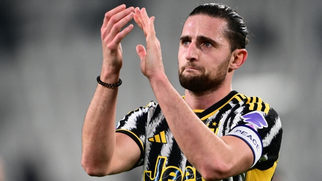 (FILES) Juventus French midfielder Adrien Rabiot greets fans at the end of the Italian Serie A football match between Juventus and Udinese at the Allianz Stadium in Turin on February 12, 2024. Adrien Rabiot is no longer a Juventus player after the Serie A club's sporting director Cristiano Giuntoli confirmed on July 18, 2024, that the France midfielder's contract would not be renewed. (Photo by MARCO BERTORELLO / AFP)