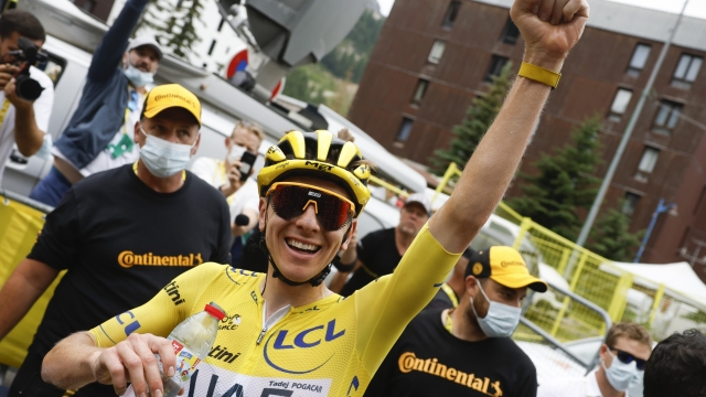 Slovenia's Tadej Pogacar, wearing the overall leader's yellow jersey, celebrates after crossing the finish line to win the nineteenth stage of the Tour de France cycling race over 144.6 kilometers (89.9 miles) with start in Embrun and finish in Isola 2000, France, Friday, July 19, 2024. (Stephane Mahe/Pool Photo via AP)    Associated Press / LaPresse Only italy and Spain