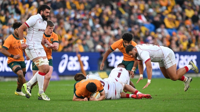 Australia's Nick Frost is tackled by Georgia's Luka Matkava during the rugby union Test match between Australia and Georgia at the Allianz Stadium in Sydney on July 20, 2024. (Photo by Izhar KHAN / AFP) / -- IMAGE RESTRICTED TO EDITORIAL USE - STRICTLY NO COMMERCIAL USE --