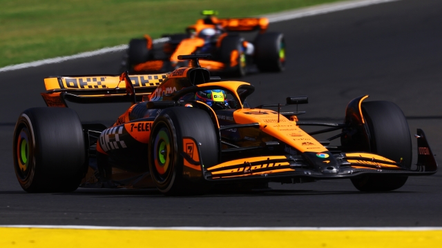 BUDAPEST, HUNGARY - JULY 21: Oscar Piastri of Australia driving the (81) McLaren MCL38 Mercedes leads Lando Norris of Great Britain driving the (4) McLaren MCL38 Mercedes during the F1 Grand Prix of Hungary at Hungaroring on July 21, 2024 in Budapest, Hungary. (Photo by Mark Thompson/Getty Images)