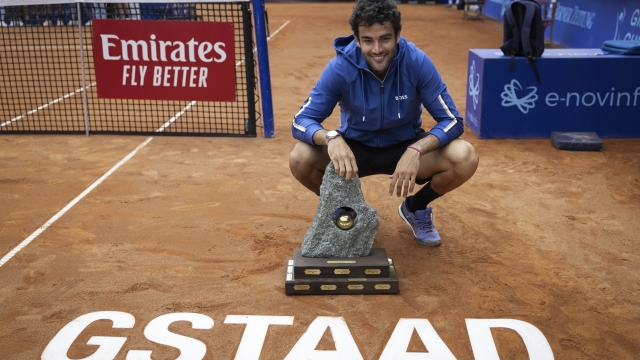 Italy's Matteo Berrettini poses with the trophy after defeating France's Quentin Halys in the men's singles final of the Swiss Open tennis tournament in Gstaad, Switzerland, Sunday, July 21, 2024. (Peter Klaunzer/Keystone via AP)