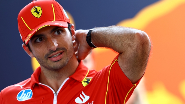 BUDAPEST, HUNGARY - JULY 18: Carlos Sainz of Spain and Ferrari looks on in the Paddock during previews ahead of the F1 Grand Prix of Hungary at Hungaroring on July 18, 2024 in Budapest, Hungary. (Photo by Mark Thompson/Getty Images)