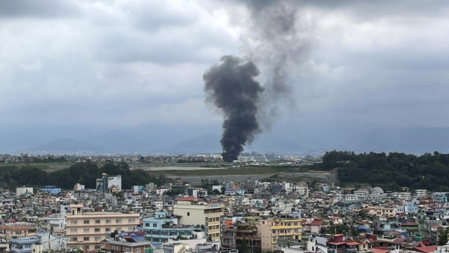 Smoke rises from the Tribhuvan International Airport in Kathmandu, Nepal, Wednesday, July 24, 2024. State television in Nepal says a plane has slipped off the runway and crashed while trying to take off from Kathmandu airport. (AP Photo/Agniia Galdanova)    Associated Press / LaPresse Only italy and Spain