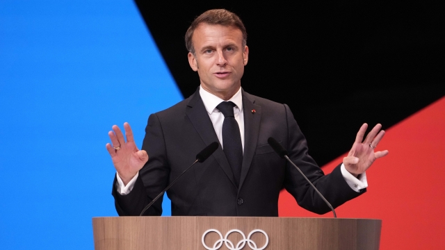 French President Emmanuel Macron speaks after IOC president Thomas Bach announced that the French Alps was named as the 2030 Winter Games host at the 2024 Summer Olympics, Wednesday, July 24, 2024, in Paris, France. The French Alps was named as the 2030 Winter Games host by the International Olympic committee on Wednesday, though with conditions attached. (AP Photo/David Goldman)