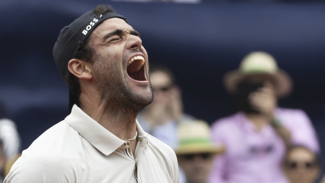 Italy's Matteo Berrettini celebrates after defeating France's Quentin Halys in the men's singles final of the Swiss Open tennis tournament in Gstaad, Switzerland, Sunday, July 21, 2024. (Peter Klaunzer/Keystone via AP)